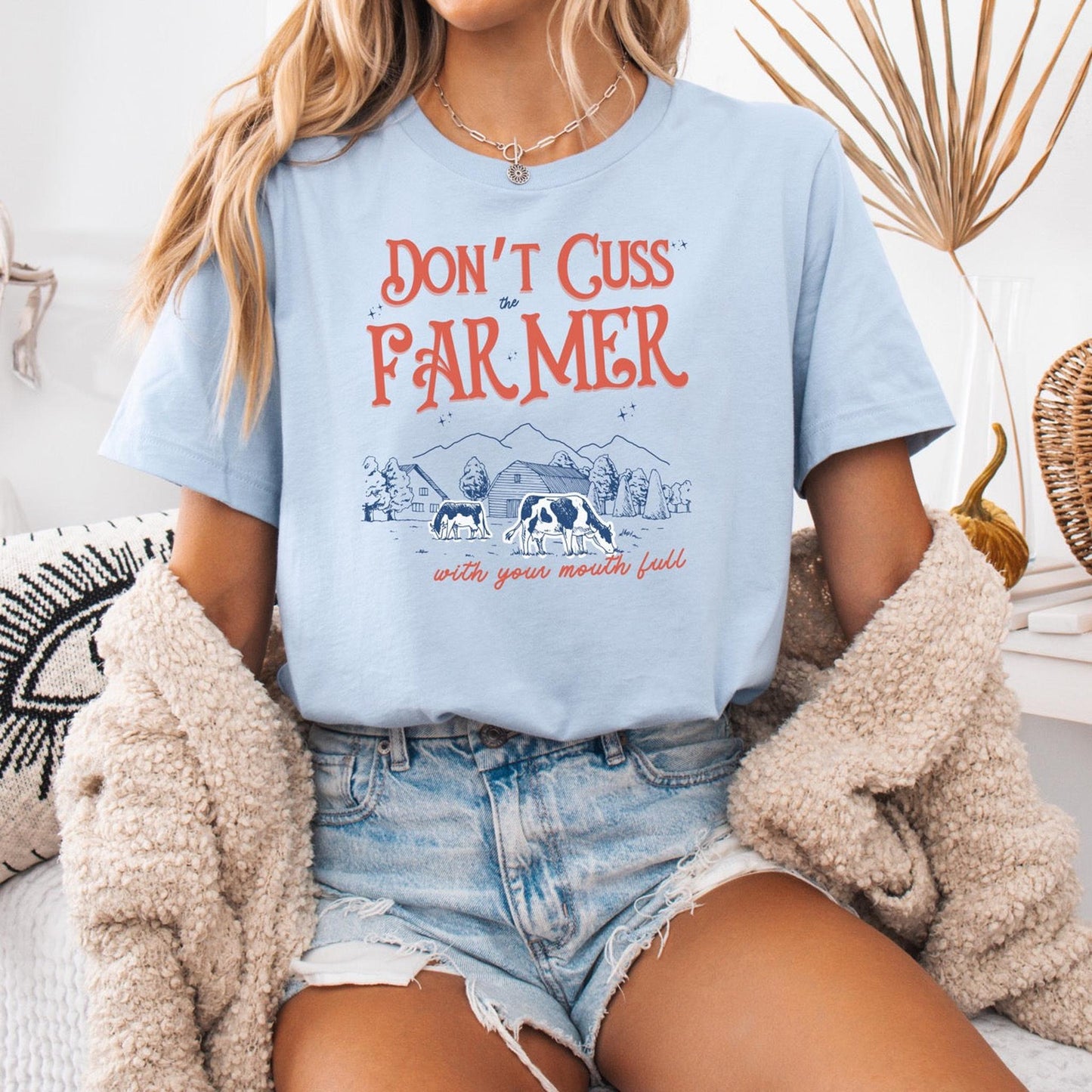 Dont cuss the farmer with your mouth full hot sweet tees farm cow buy local southern theme birthday gift womens gift farming peach mockup free shipping hot sweet tees country themed patriotic farmer farmer lovers farming southern pride cattle farmer cows farm ranch beef is what’s for dinner Baby blue t shirt unisex farmer cattle farmer beef overs cow lovers free shipping
