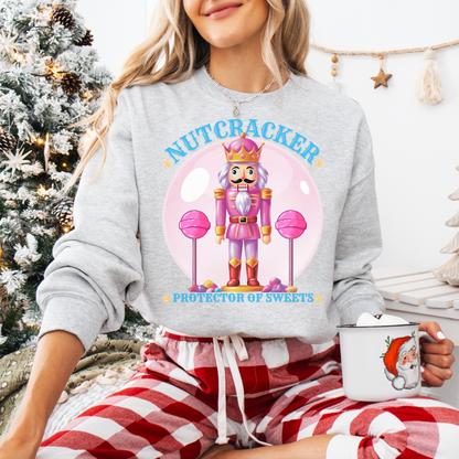Christmas Nutcracker Sweater Protector of Sweets Pullover  
Holiday Nutcracker Design  
Cute Candy Themed Sweatshirt
Pink Nutcracker Cotton Sweater  
Festive Holiday Pullover  
Nutcracker Ballet Inspired Apparel  
Whimsical Christmas Sweatshirt  
USA Made Holiday Sweater  
Cozy Cotton Christmas Pullover  
Sweets Guardian Nutcracker Shirt  
Modern Nutcracker Graphic Tee  
Candy Land Holiday Wear  
Regal Nutcracker King Sweater  
Enchanted sweet candy Sweater hotsweettees free shipping