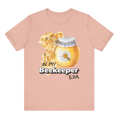 In my beekeeper era unisex t shirt hot sweet tees free shipping Taylor swift eras tour swifties birthday gift bee lovers honey bees spring time gifts summer in my era collection birthday gift girlie shirt spring themed birthday gift bee lovers gift women’s bee keeper shirt unisex bee t shirt hot sweet tees unique t shirt spring time themed t shirt honey bee honey Peach 