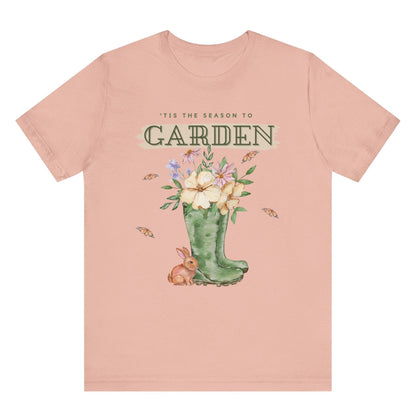 Tis the season to garden hotsweettees spring time gardening gardener gift free shipping unisex soft spring t shirt spring bunny rain boots butterflies watercolor flowers Gift garden spring time pastels Easter bunny Peach tee brown bunny