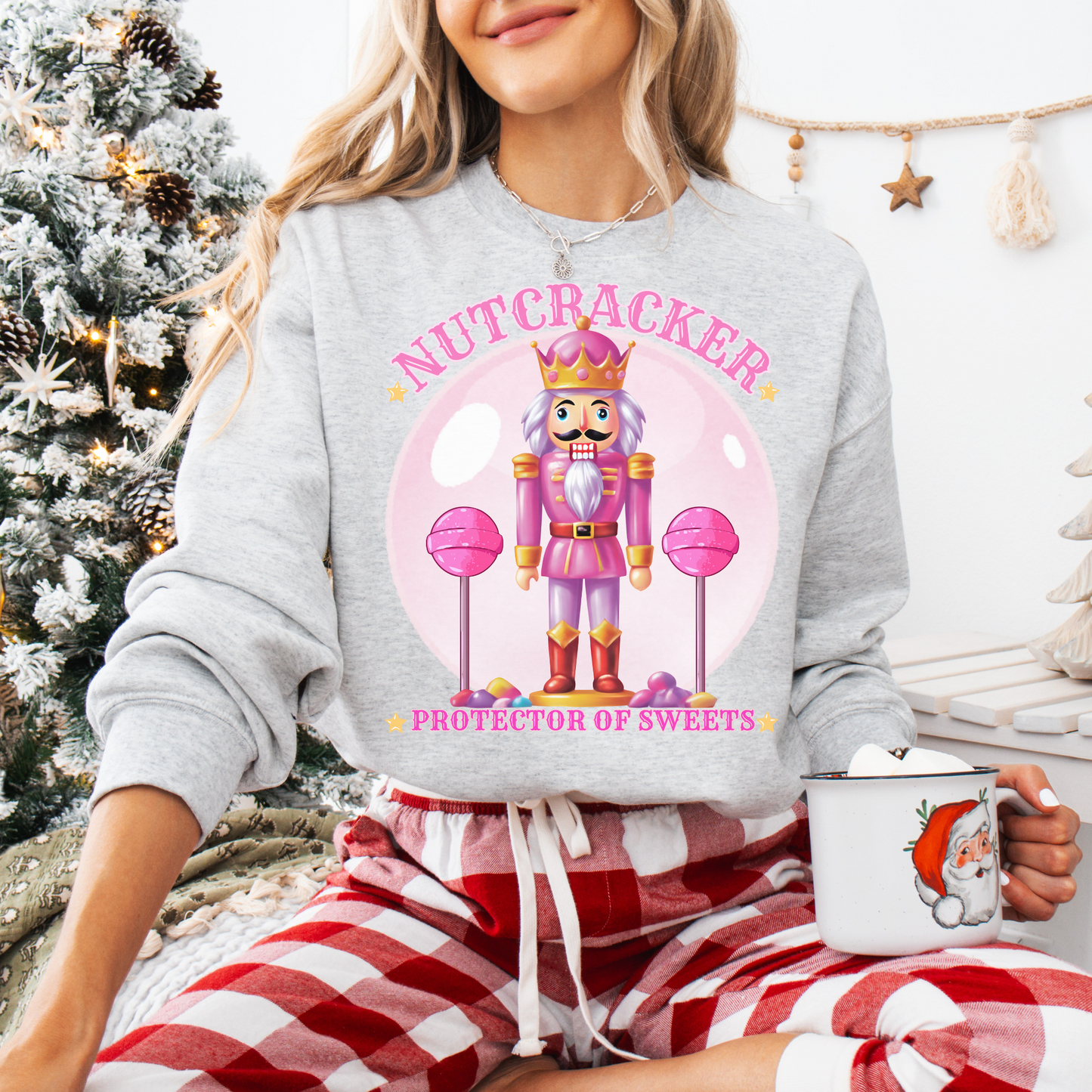  Christmas Nutcracker Sweater Protector of Sweets Pullover  
Holiday Nutcracker Design  
Cute Candy Themed Sweatshirt
Pink Nutcracker Cotton Sweater  
Festive Holiday Pullover  
Nutcracker Ballet Inspired Apparel  
Whimsical Christmas Sweatshirt  
USA Made Holiday Sweater  
Cozy Cotton Christmas Pullover  
Sweets Guardian Nutcracker Shirt  
Modern Nutcracker Graphic Tee  
Candy Land Holiday Wear  
Regal Nutcracker King Sweater  
Enchanted sweet candy Sweater hotsweettees free shipping