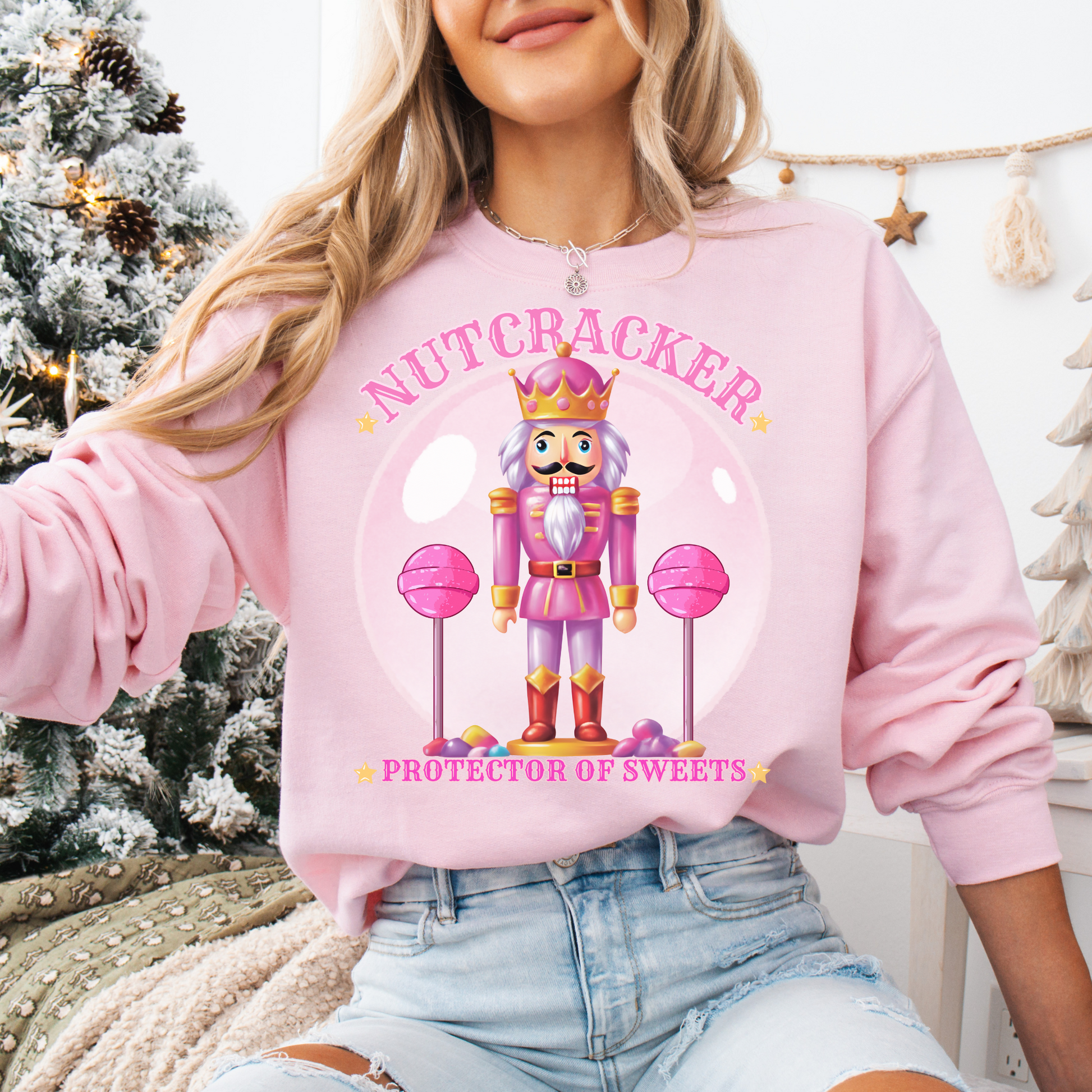  Christmas Nutcracker Sweater Protector of Sweets Pullover  
Holiday Nutcracker Design  
Cute Candy Themed Sweatshirt
Pink Nutcracker Cotton Sweater  
Festive Holiday Pullover  
Nutcracker Ballet Inspired Apparel  
Whimsical Christmas Sweatshirt  
USA Made Holiday Sweater  
Cozy Cotton Christmas Pullover  
Sweets Guardian Nutcracker Shirt  
Modern Nutcracker Graphic Tee  
Candy Land Holiday Wear  
Regal Nutcracker King Sweater  
Enchanted sweet candy Sweater hotsweettees free shipping