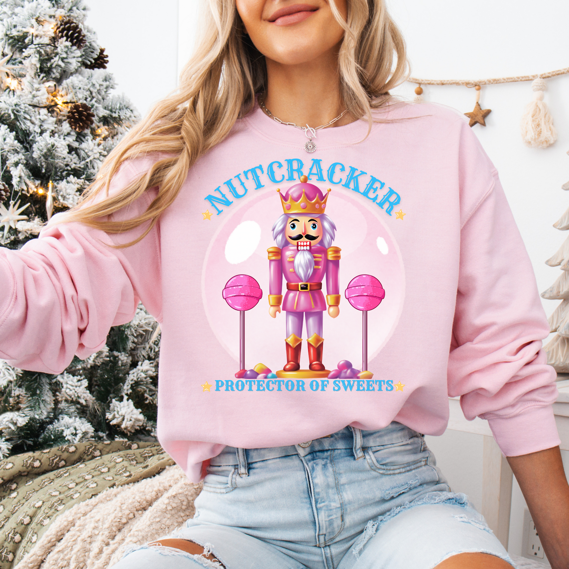 Christmas Nutcracker Sweater Protector of Sweets Pullover  
Holiday Nutcracker Design  
Cute Candy Themed Sweatshirt
Pink Nutcracker Cotton Sweater  
Festive Holiday Pullover  
Nutcracker Ballet Inspired Apparel  
Whimsical Christmas Sweatshirt  
USA Made Holiday Sweater  
Cozy Cotton Christmas Pullover  
Sweets Guardian Nutcracker Shirt  
Modern Nutcracker Graphic Tee  
Candy Land Holiday Wear  
Regal Nutcracker King Sweater  
Enchanted sweet candy Sweater hotsweettees free shipping
